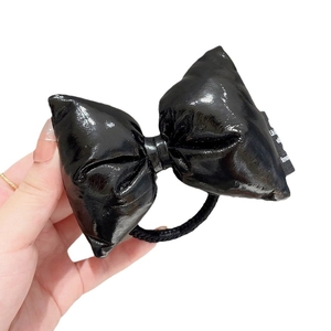 Glossy black faux leather oversized bow hair tie with elastic band for ponytails