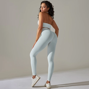 Detail view of light blue seamless ribbed yoga set with halter top and high waist leggings