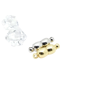 Golden and silver capsule magnetic jewelry clasps for DIY necklaces on white background