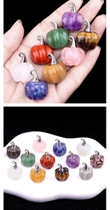 Detailed close-up of colorful pumpkin crystal pendants with silver metal clasps