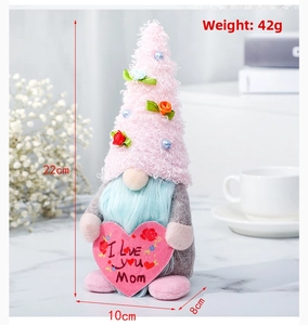 Detail of Mother's Day gnome featuring 'I Love You Mom' heart and floral plush hat