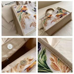 Detailed embroidery of birds and flowers on large capacity jute canvas tote bag with magnetic clasp