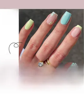 Detail of French press-on nails with yellow and blue floral patterns and square tip design