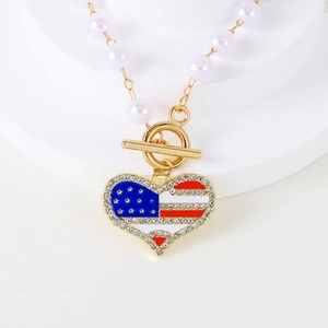 Detail of USA flag heart pendant with sparkling rhinestones and white faux pearls