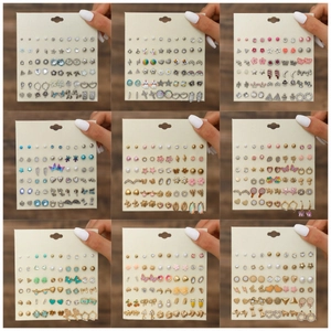 Detail showing assorted stud earring sets with butterfly, flower and starfish designs