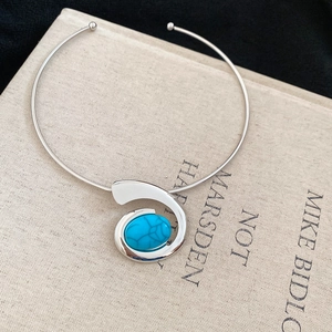 Vintage silver metal collar necklace with an oval blue turquoise swirl pendant