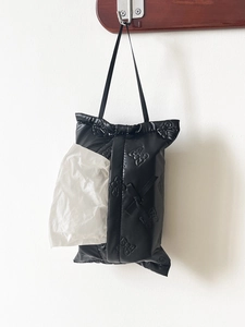 Hanging black quilted tissue box holder with 3D butterfly embossing and carry handle