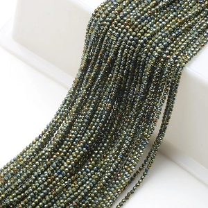 Macro view of metallic faceted glass beads for jewelry making with iridescent finish