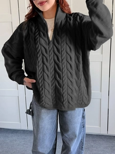 Detailed cable knit texture and half-zip collar on this casual black women's sweater