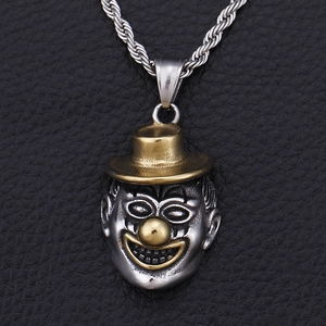 Hip hop clown pendant in silver and gold stainless steel on a black leather texture