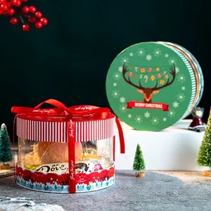 Cylindrical transparent Christmas gift box with red striped lid and festive ribbon