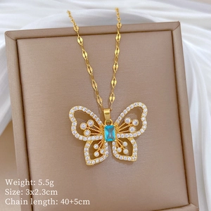 Detail of gold butterfly necklace with blue stone and white crystals, weight and size specs