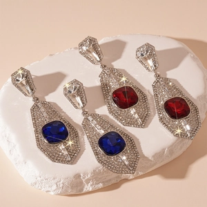 Vintage luxury earrings with square gemstones and rhinestones on white stone base