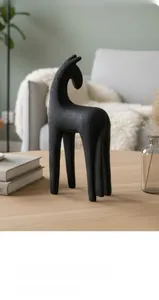 Detail of minimalist black resin horse sculpture with a matte grainy texture finish