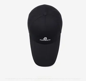 Top down view of black cotton baseball cap with white embroidered letter B logo