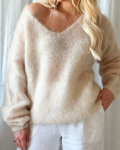 Detail view of the soft v-neck mohair knit sweater with fluffy knit texture in cream white