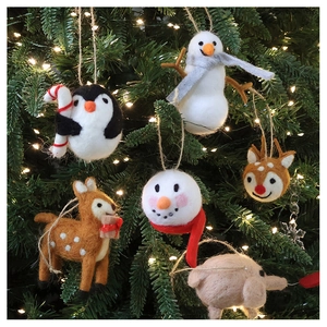 Handmade wool felt Christmas ornaments set with penguin, reindeer and snowman on a tree