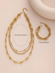Detail shot of golden double-layer bamboo chain necklace and bracelet with size markings