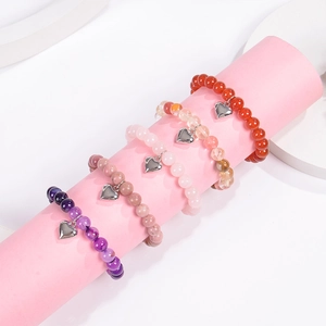 Natural agate beaded bracelets with heart pendants in purple, pink, and orange tones