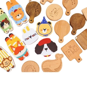 Creative wooden coasters in diverse animal shapes like bear, fox and whale on white background