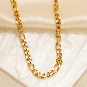 18K gold plated stainless steel Cuban Figaro chain necklace displayed on silk fabric