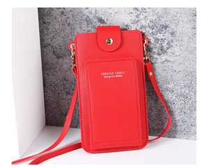 Detail of red leather crossbody phone bag with gold metal snap and logo print