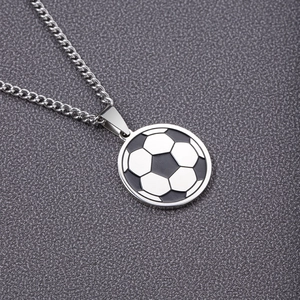 Polished stainless steel soccer ball pendant necklace for sports lovers on grey texture