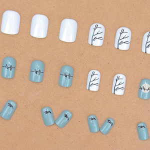 Minimalist blue sunset bird silhouette press-on nails set with elegant branch art