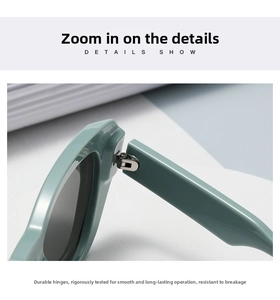 Close-up of the durable metal hinge construction on small frame black sunglasses