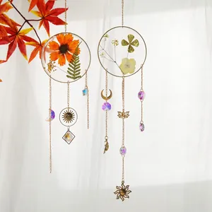 Set of 2 dried flower crystal suncatchers with gold sun and moon metal charms