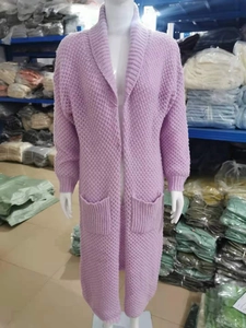 Detail of light purple long knit cardigan showing coarse texture and large pockets