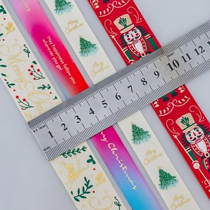 Christmas gold foil ribbons with nutcracker and tree patterns measuring 1cm to 2.5cm