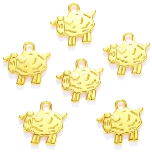 Detailed view of six golden sheep-shaped metal pendants for DIY jewelry and crafts