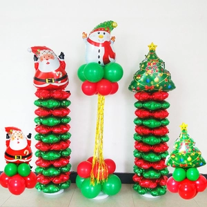 Detail of Christmas balloon set featuring Santa Claus, snowman, and gold tassels