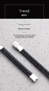 Macro detail of men's braided leather bracelet with a brushed stainless steel buckle