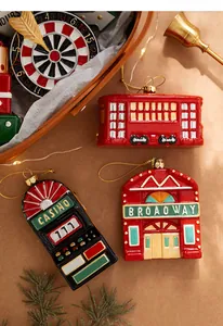 Detail of vintage Christmas ornaments featuring Broadway theatre and casino slot machine