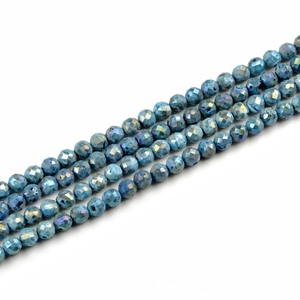 Macro view of blue faceted agate druzy beads arranged in parallel for jewelry making