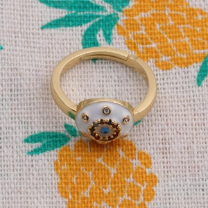 Detailed top view of gold-plated evil eye ring with colorful enamel and zircon stones