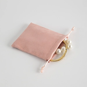 Pink microfiber drawstring jewelry pouch with soft velvet texture for gift packaging