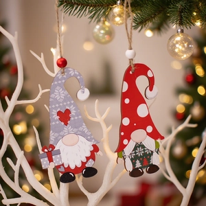Wooden Christmas gnome ornaments set in red and grey hanging on tree branches