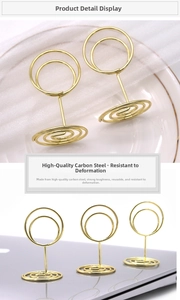 Macro shot of durable golden carbon steel photo holders with stable spiral bases