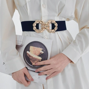Detail of wide black elastic waist belt with gold double-ring interlocking buckle
