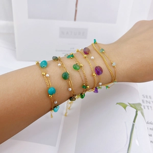 Bohemian double-layered gold bracelet with colorful stones, purple beads, and pearls