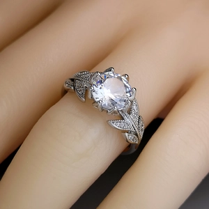 Elegant silver leaf ring with round brilliant zircon and micro-pave leaf accents