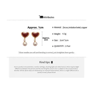 Detail view showing dimensions of heart-shaped pearl earrings with silver posts