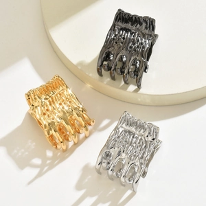 Lava texture metal hair claws in gold, silver, and black finishes for high ponytail styles