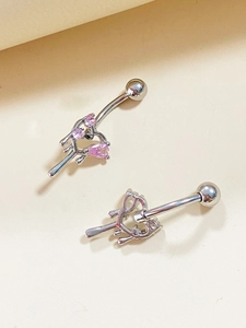 Detailed view of silver navel ring featuring pink pear-shaped cubic zirconia crystals