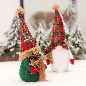 Standing Christmas forest gnome dolls with red plaid hats and festive pine bouquets