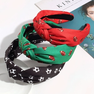 Three-pack knotted headbands with soccer and rugby patterns in red, green, and black