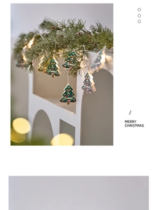 Close-up of LED Christmas tree string lights with Snow text on festive pine branches